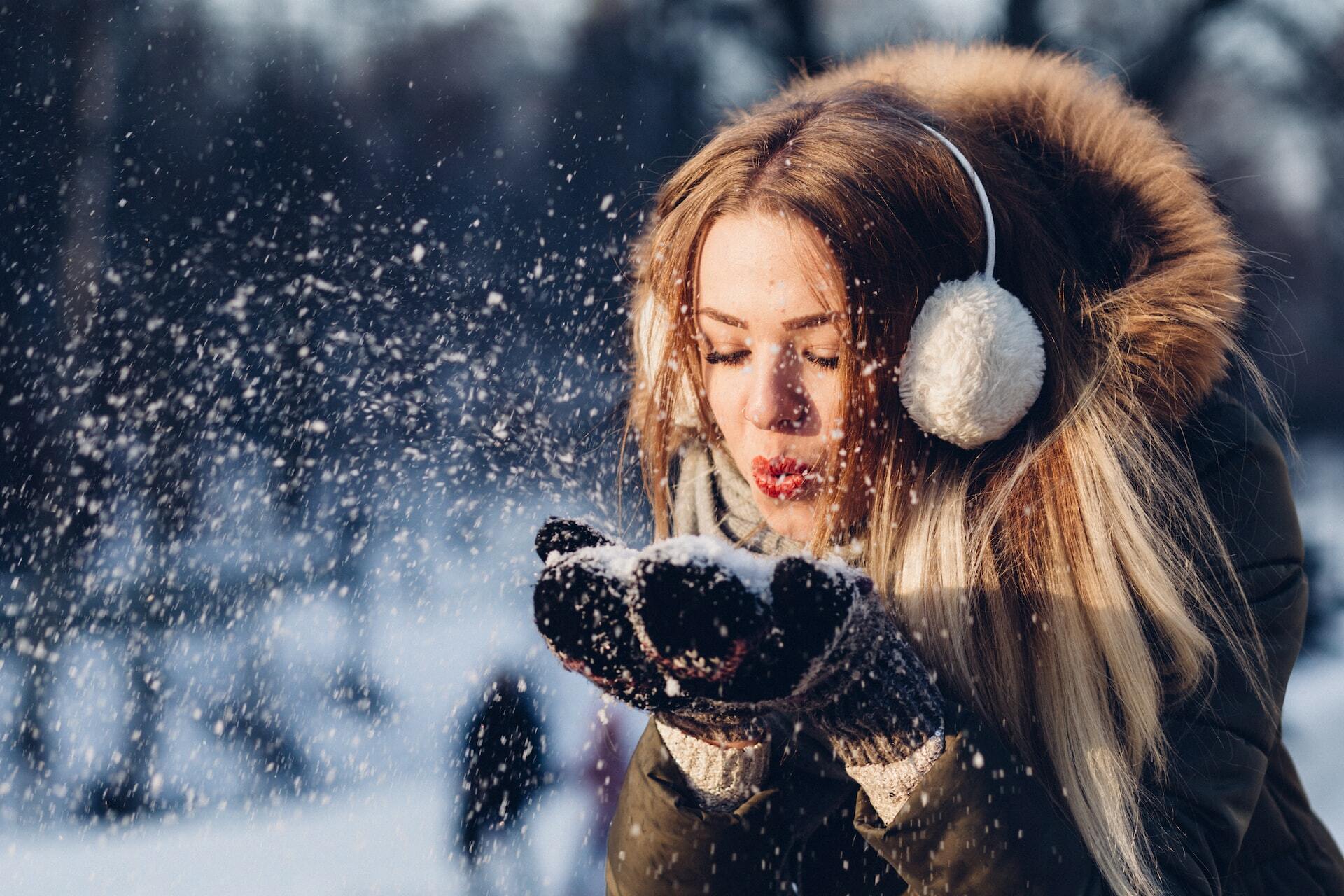 woman playing in the snow