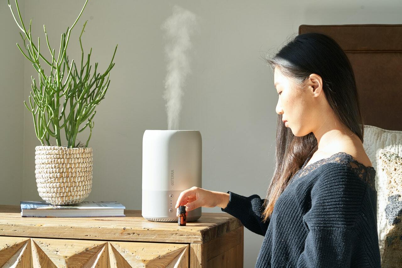 woman using humidifier