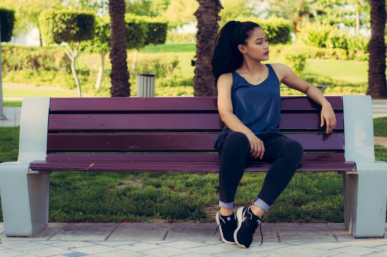 woman sitting on bench